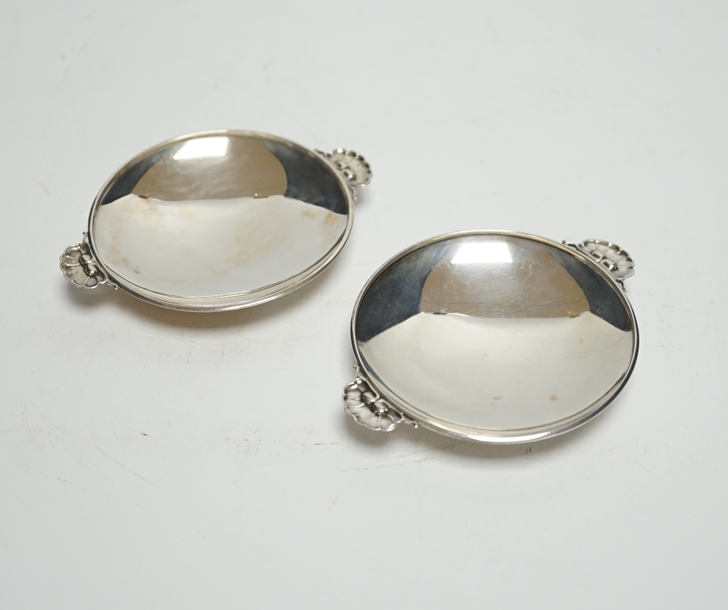 A pair of small 1930's Georg Jensen sterling dishes, with fluted lug handles, 94mm.